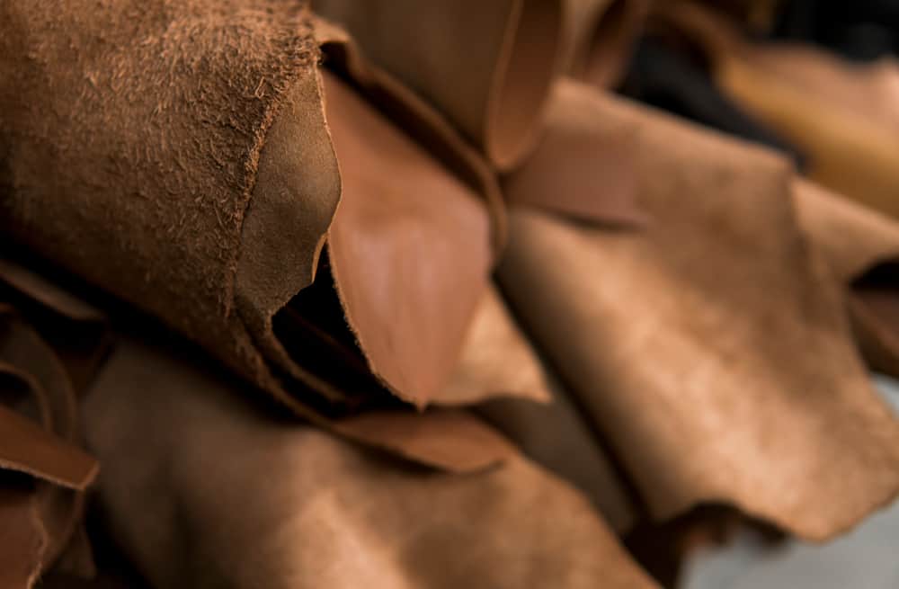 These are various leather pieces stored together in a shop.