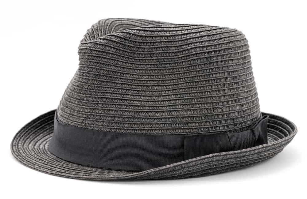 A gray kettle brim hat with black ribbon.