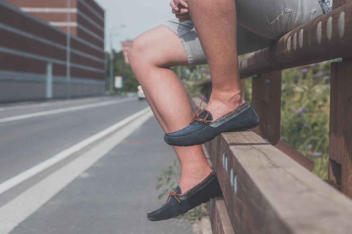 A photo of man wearing loafers.