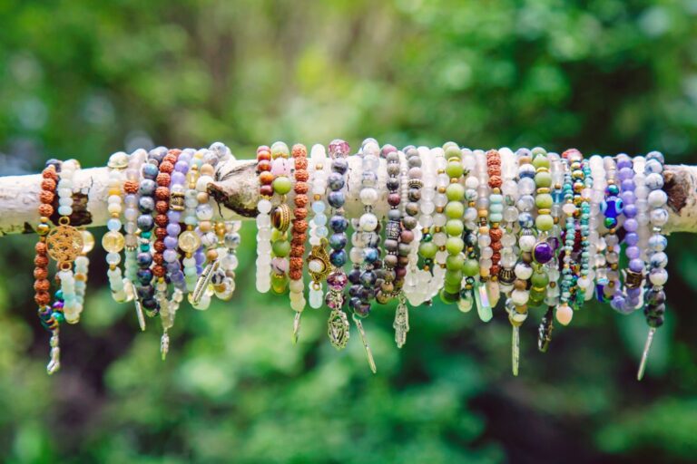 A collection of crystal mineral stone bracelets.