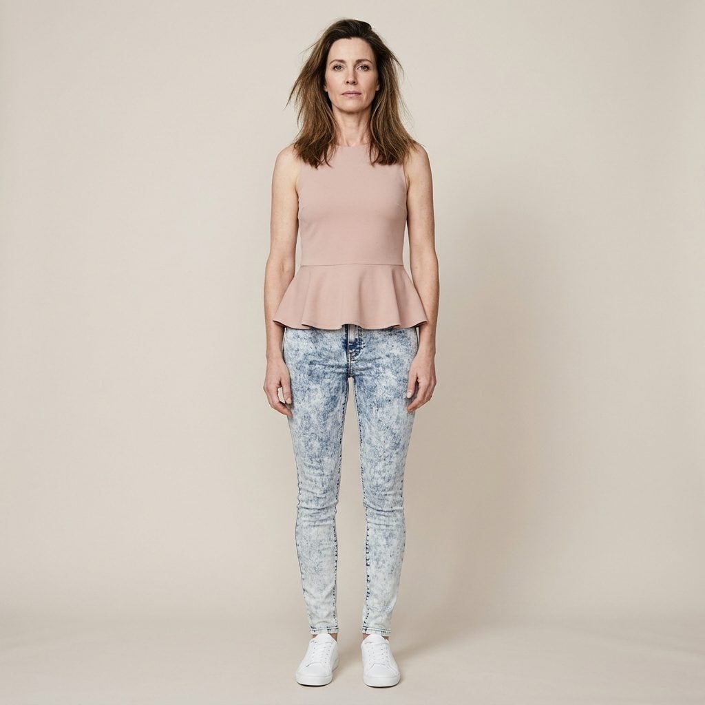 Acid-Wash Skinnies + a Peplum Top: When Two Dated Trends Meet White Sneakers