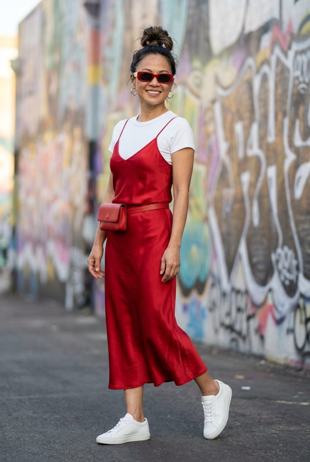 Red Satin Slip Dress Over a White Tee with Matching Belt Bag Is a Declaration