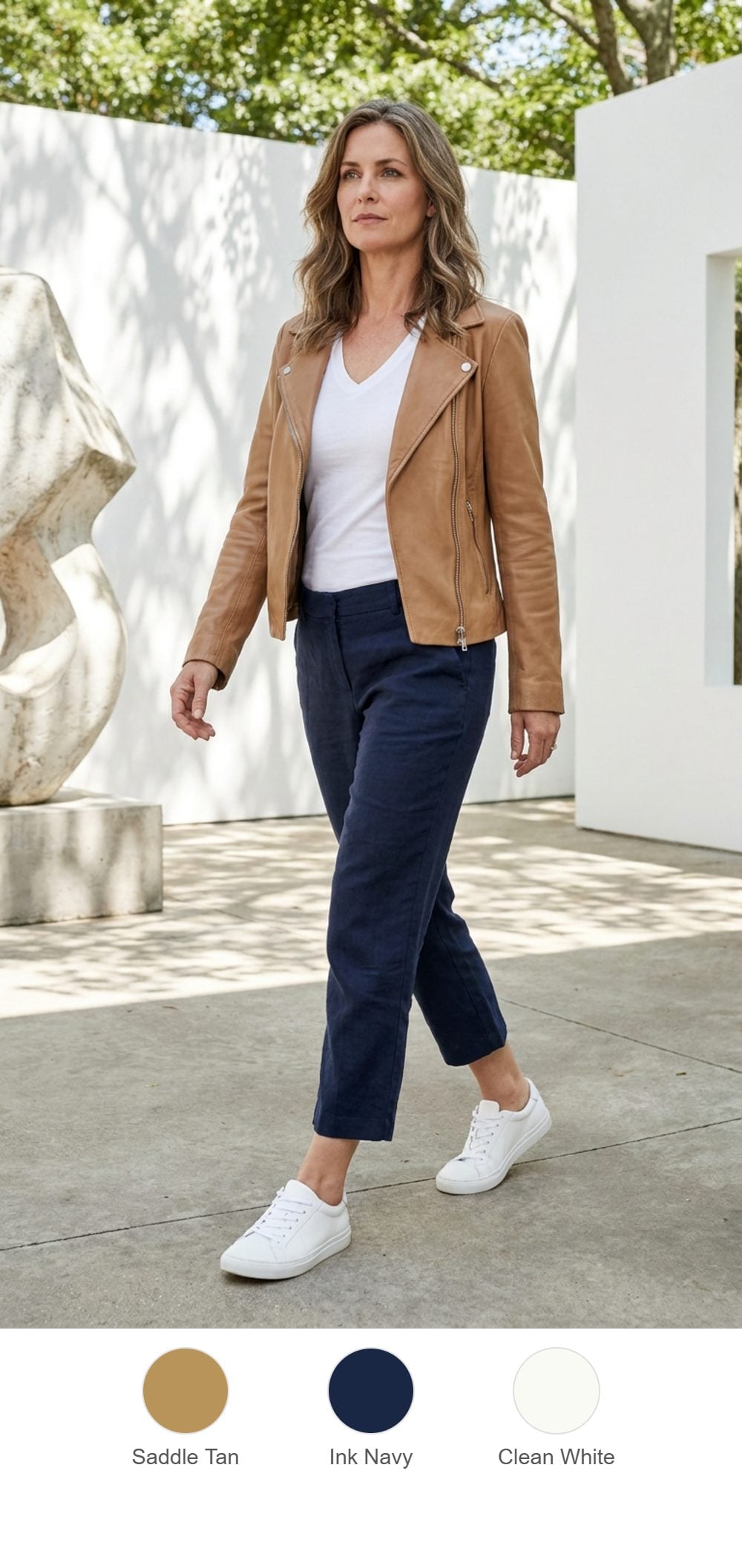 Tan Leather Moto Blazer and Navy Linen Through a Gallery Courtyard