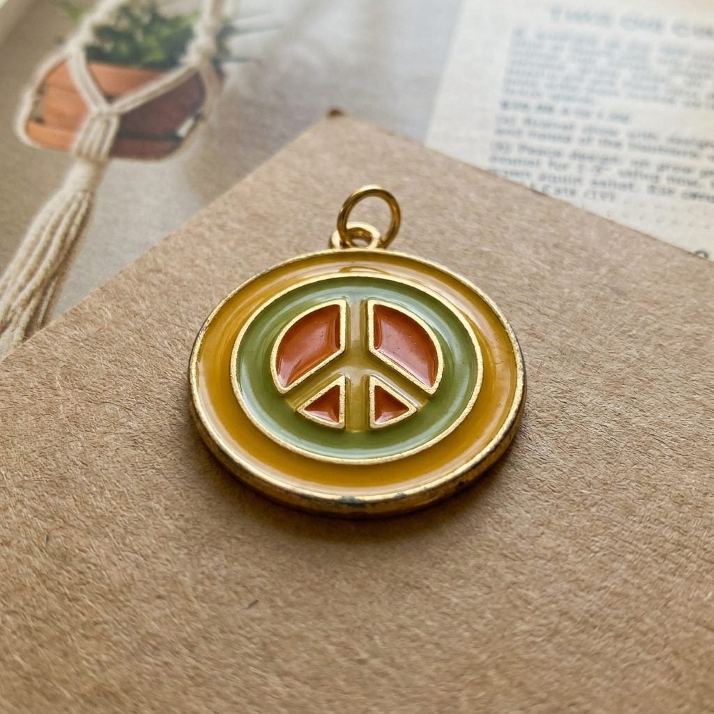 The Enamel Peace Sign Charm in Yellow, Green, and Orange