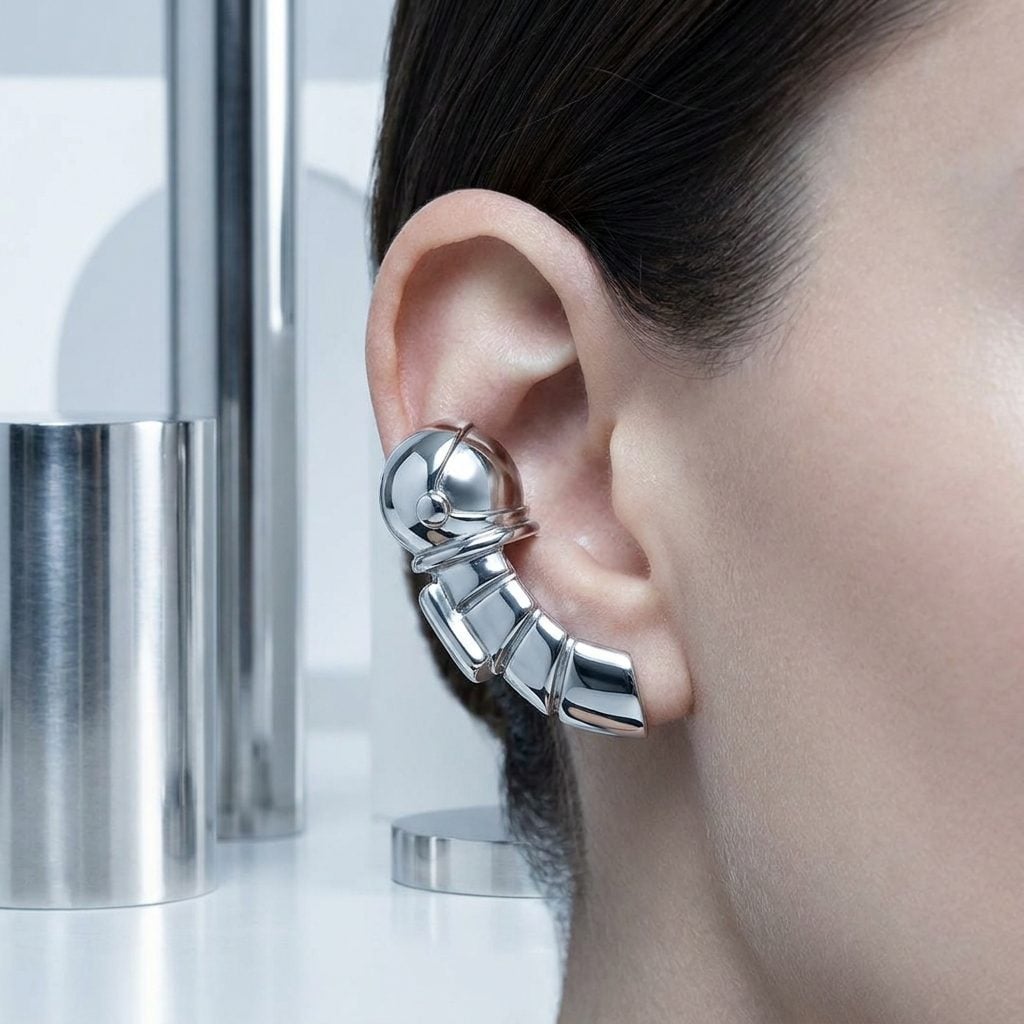 Space Age Silver Cuffs That Clipped to the Ear Like a Tiny Helmet