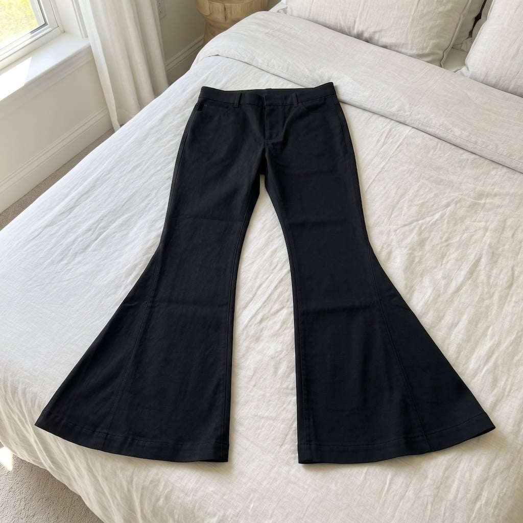 black bootcut pants on bed