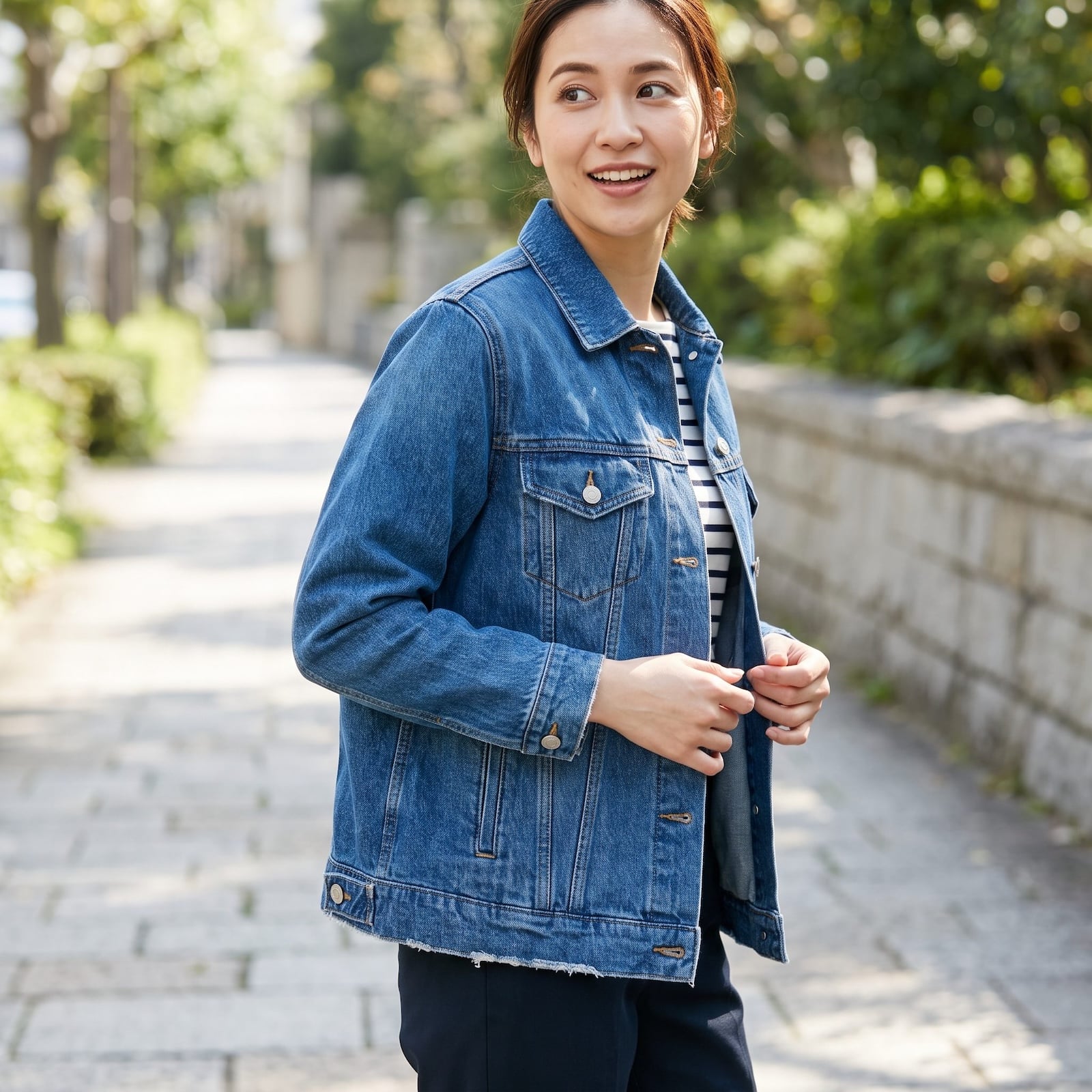 Woman wearing a denim jacket with jeans in a double-denim outfit