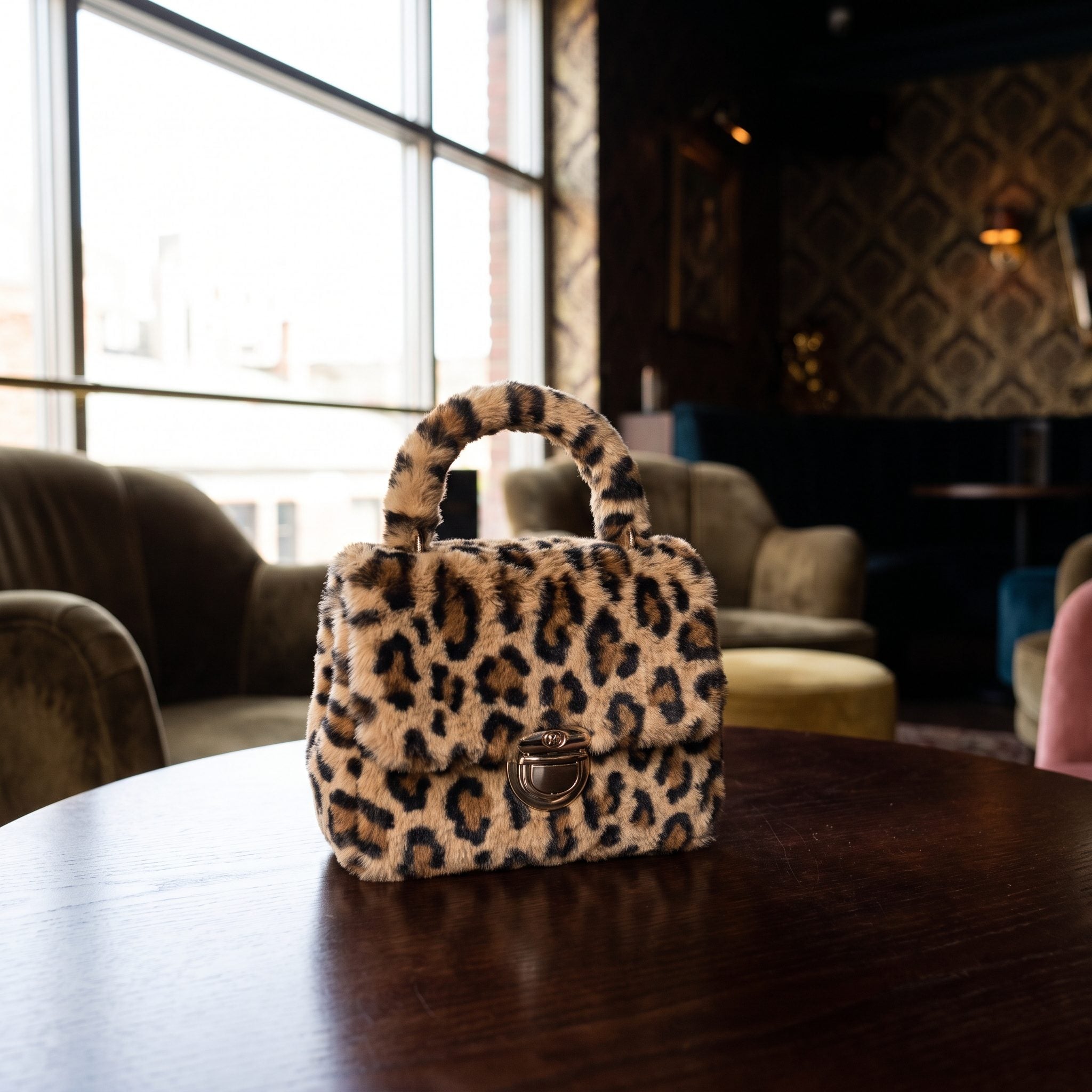 Leopard-print mini handbag with black tailored outfit