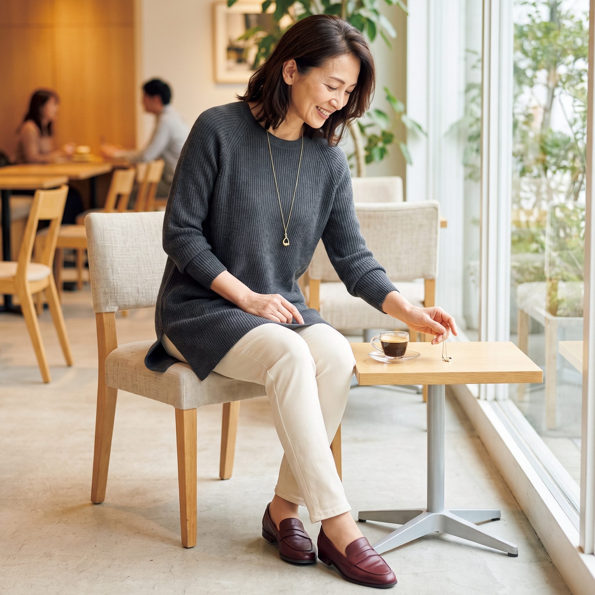 The Long Pendant Necklace That Swings Into Your Coffee