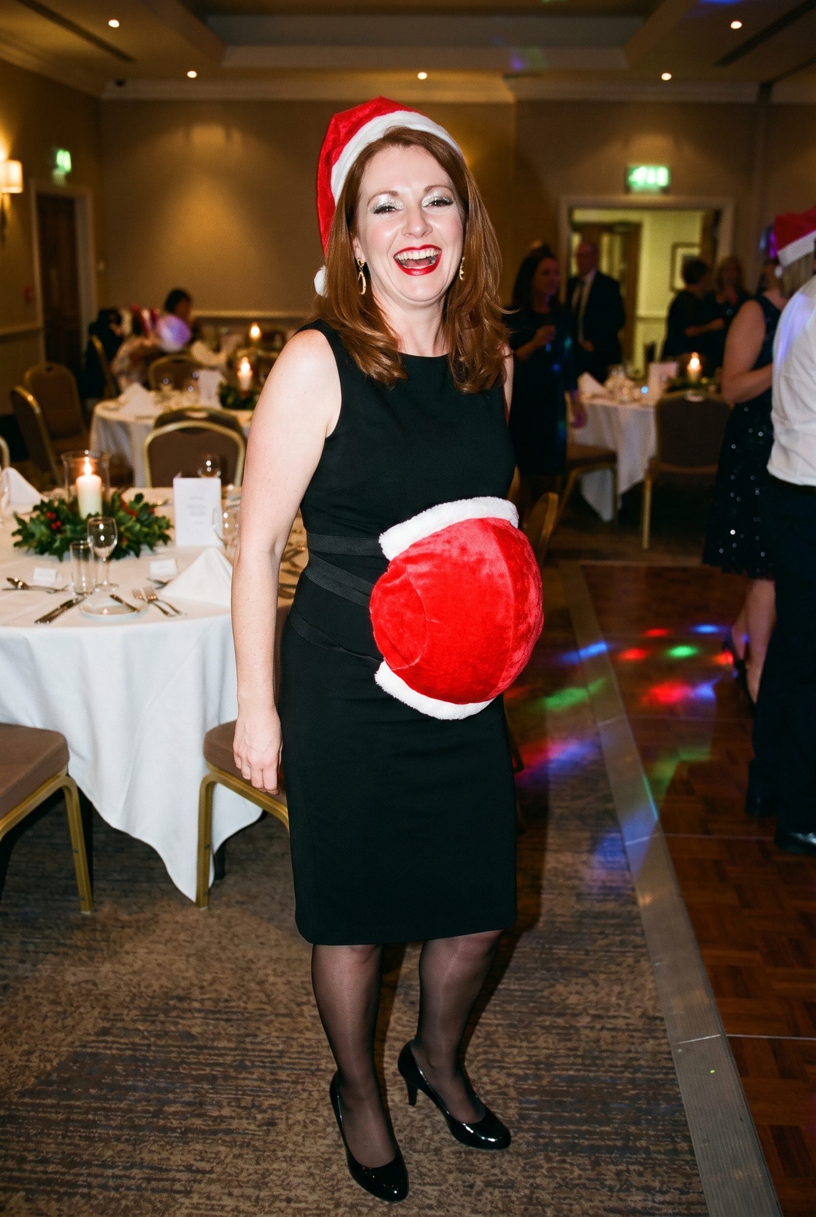 The Plush Santa Belly Strapped Over a Cocktail Dress