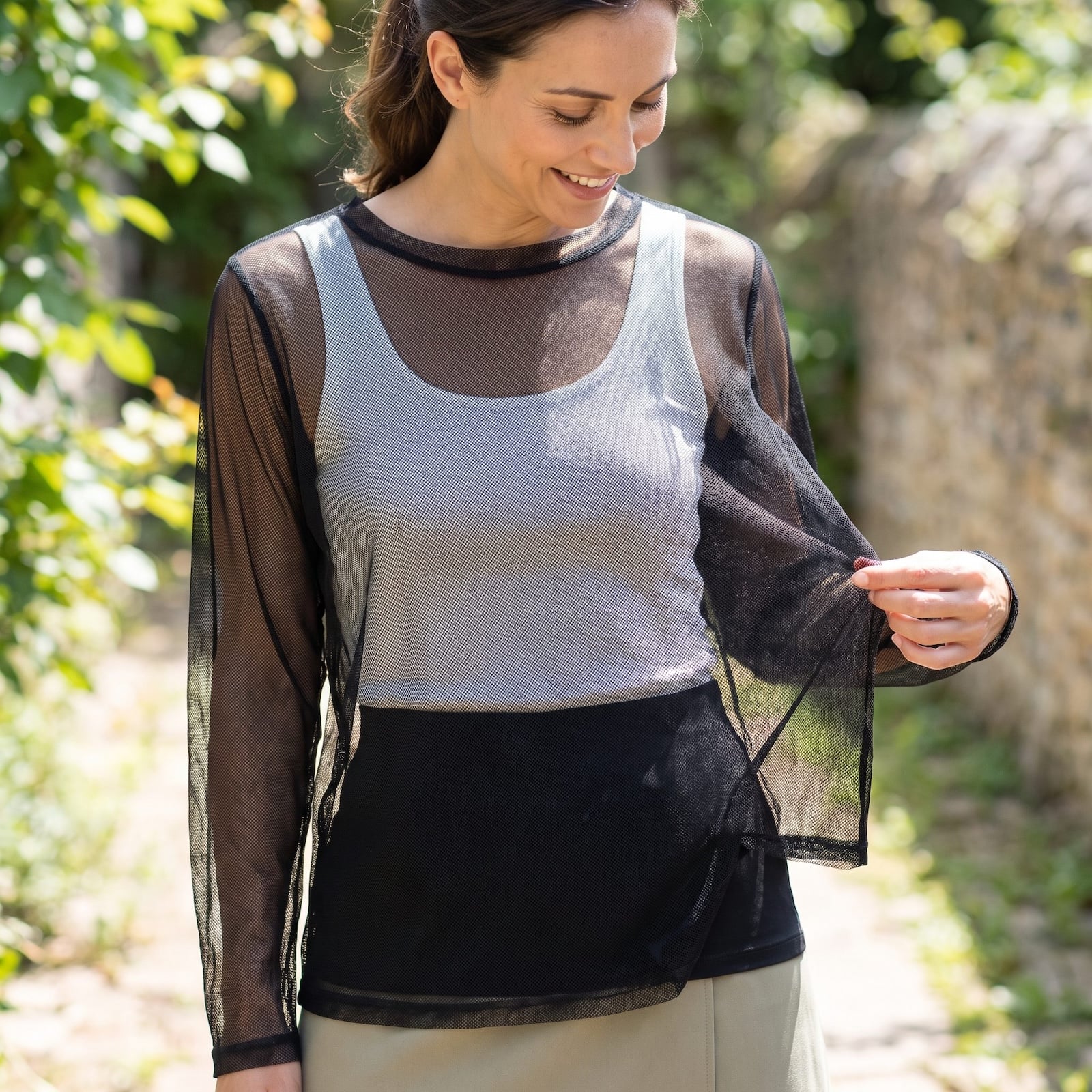 woman wearing sheer mesh top