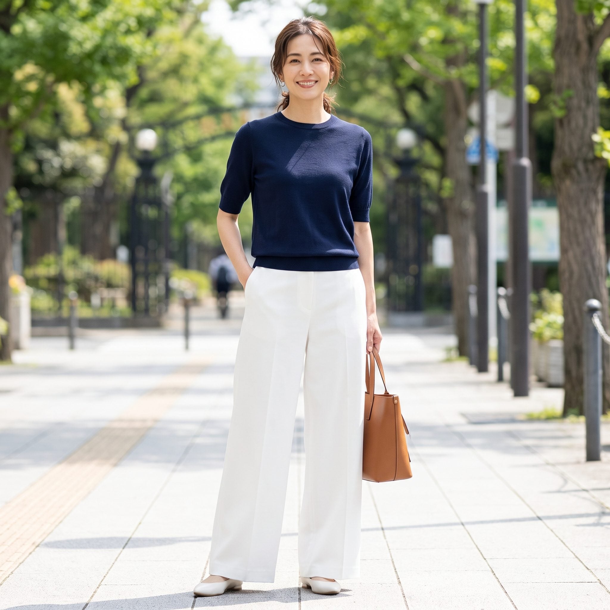 White wide-leg trousers styled with a navy knit top