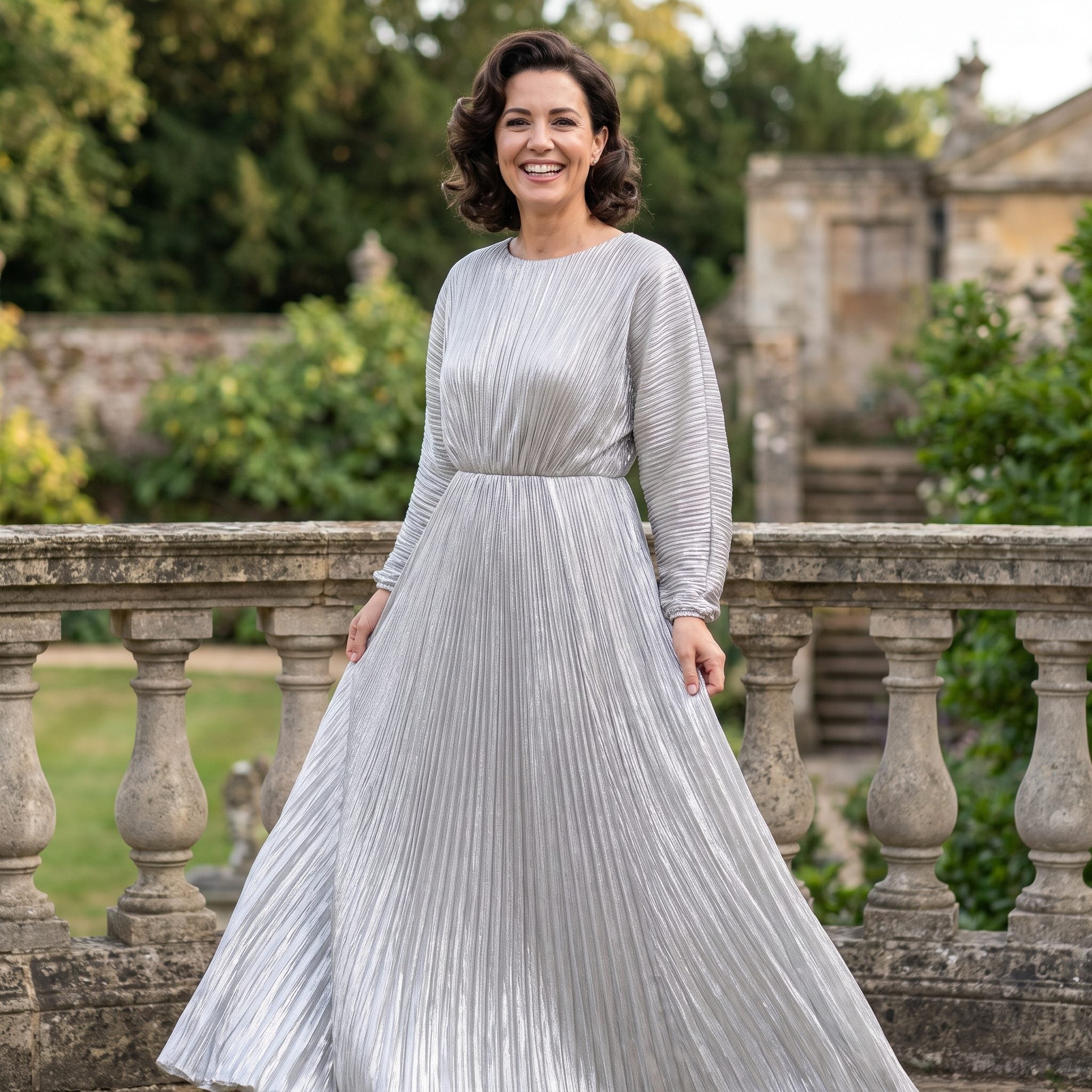 Silver lamé evening gown with fine plissé pleating and a high halter neckline