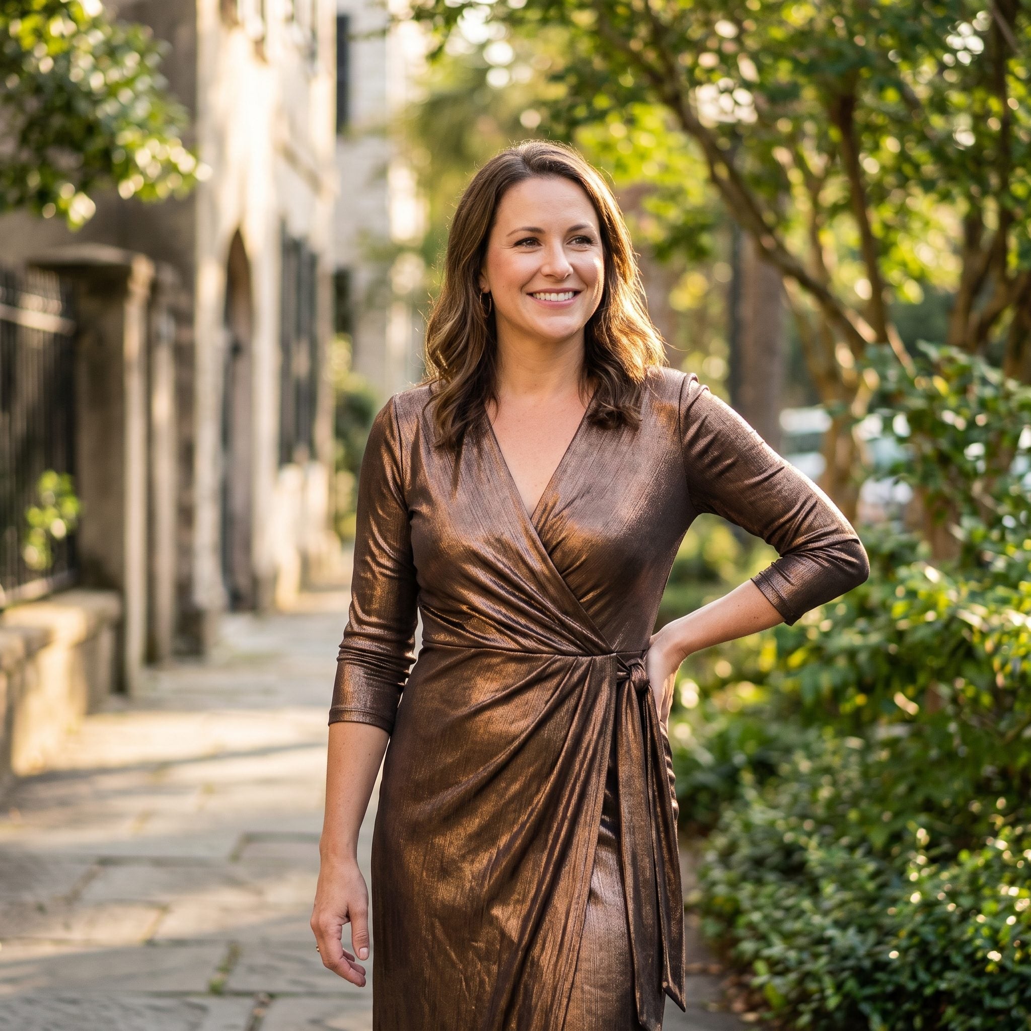 Bronze metallic wrap dress with softly draped fabric and chocolate suede pumps