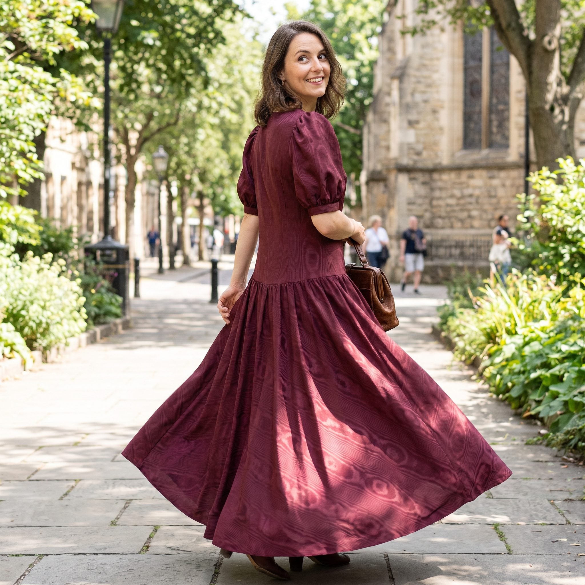 Burgundy moiré evening dress with a dropped waist and gathered skirt