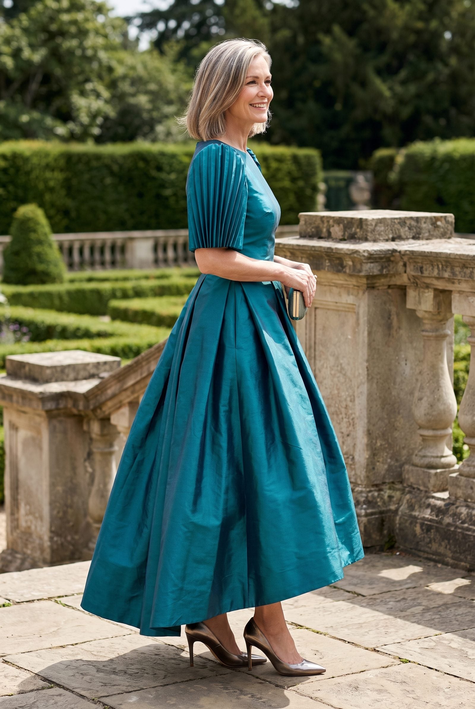 Woman in a stiff emerald taffeta dress with a skirt standing away from the body at a hotel ballroom.