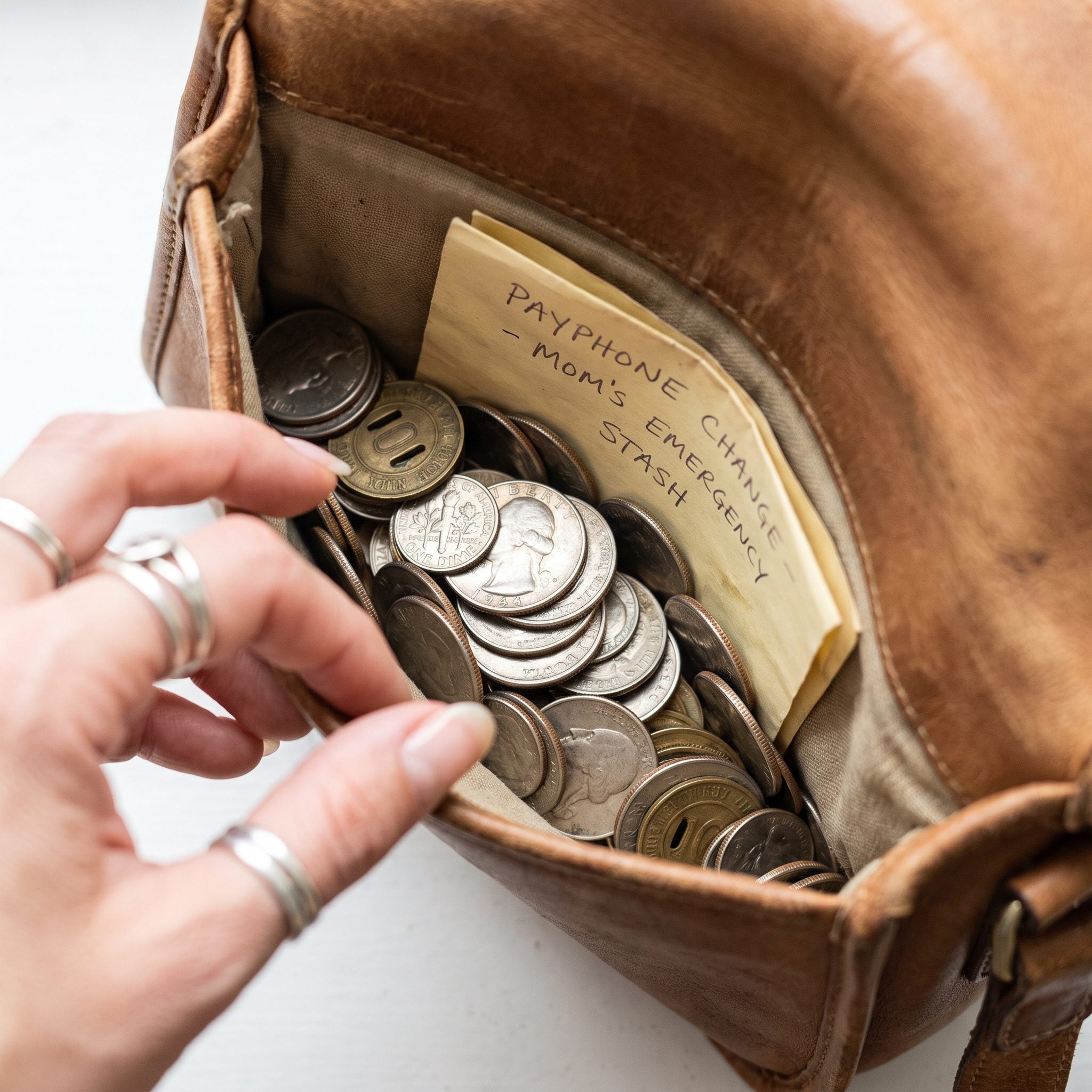 Coin Change Tucked in the Side Pocket for Payphones