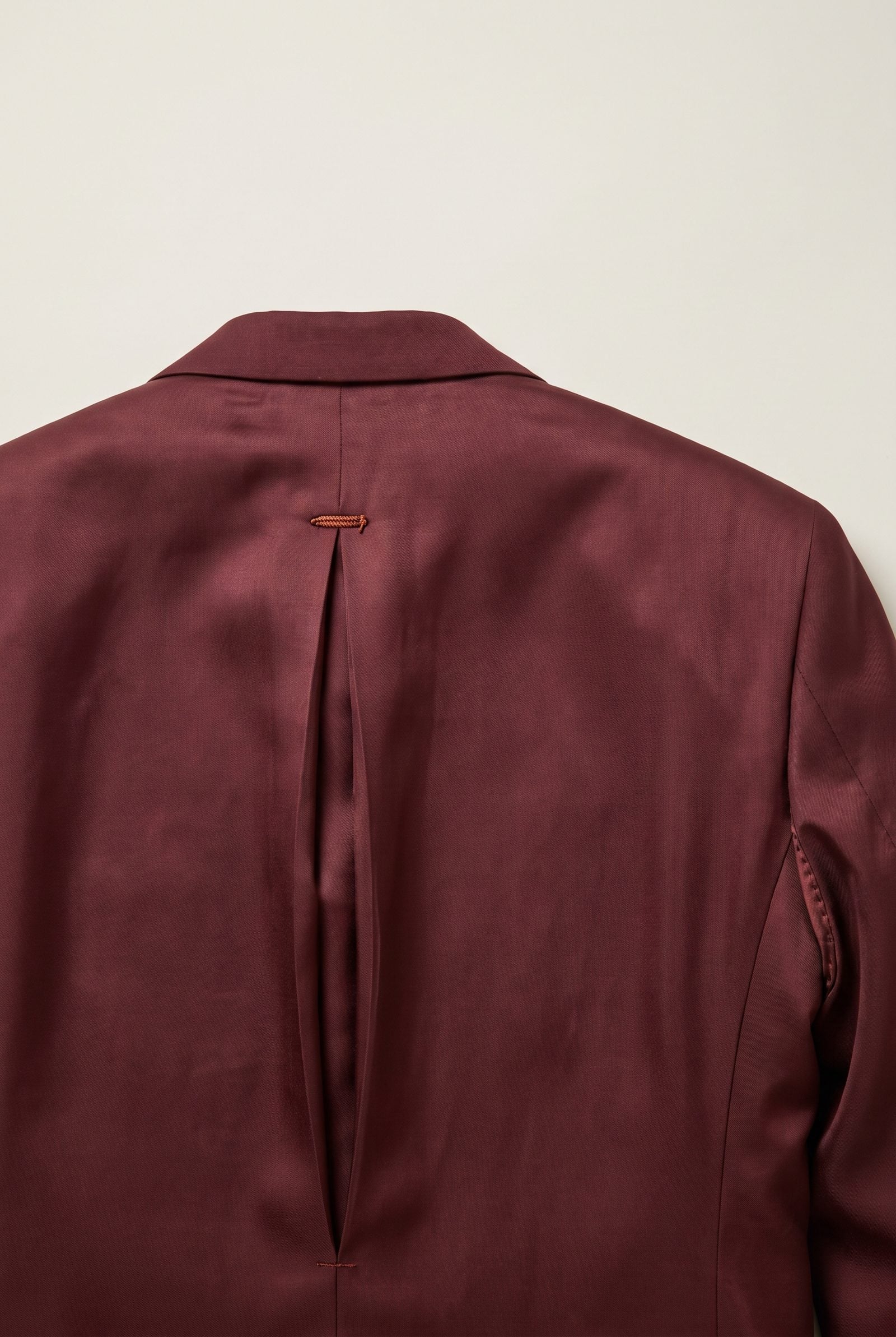 The Ease Pleat Tucked Into a Jacket Lining