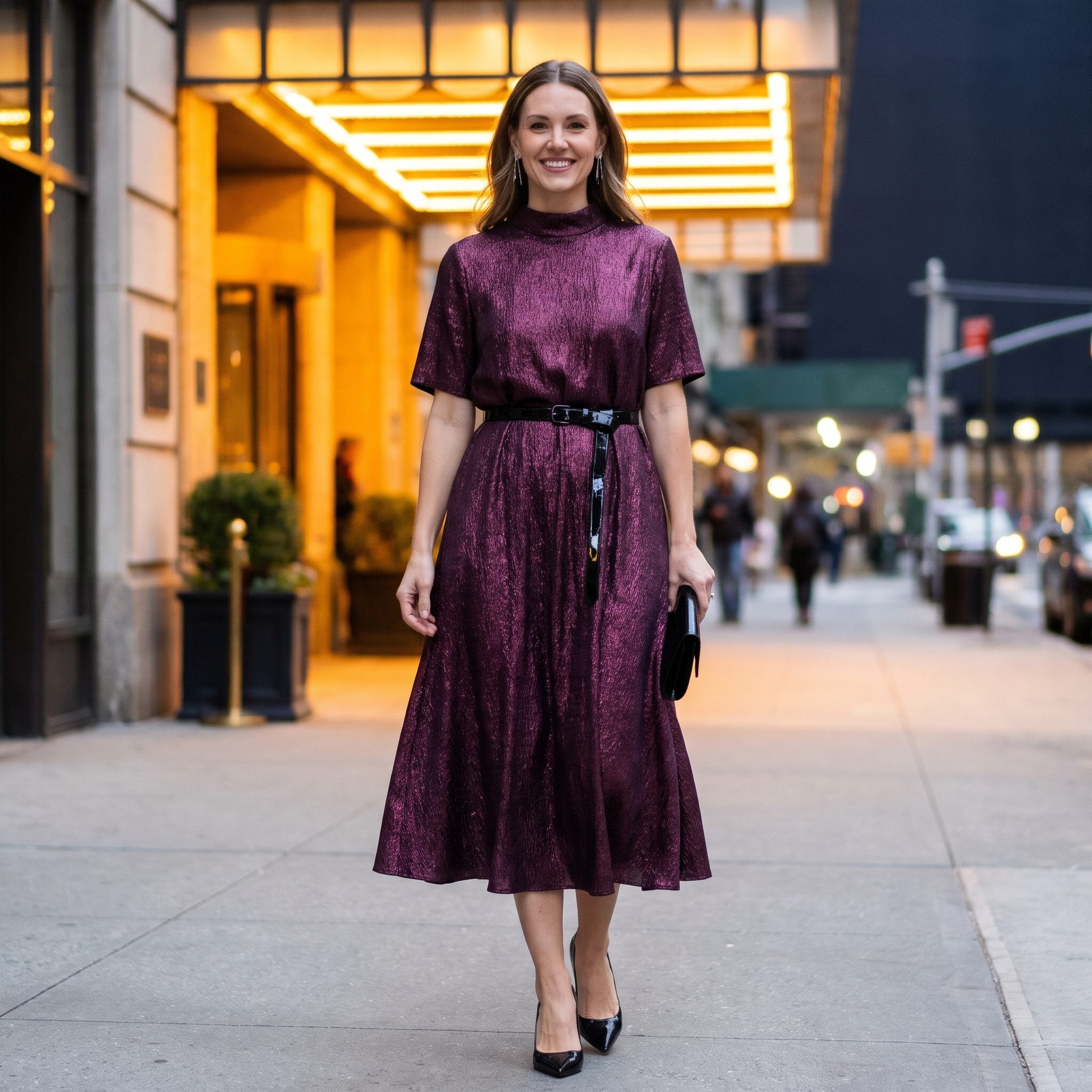Plum metallic evening dress with a glossy black belt worn low on the hips