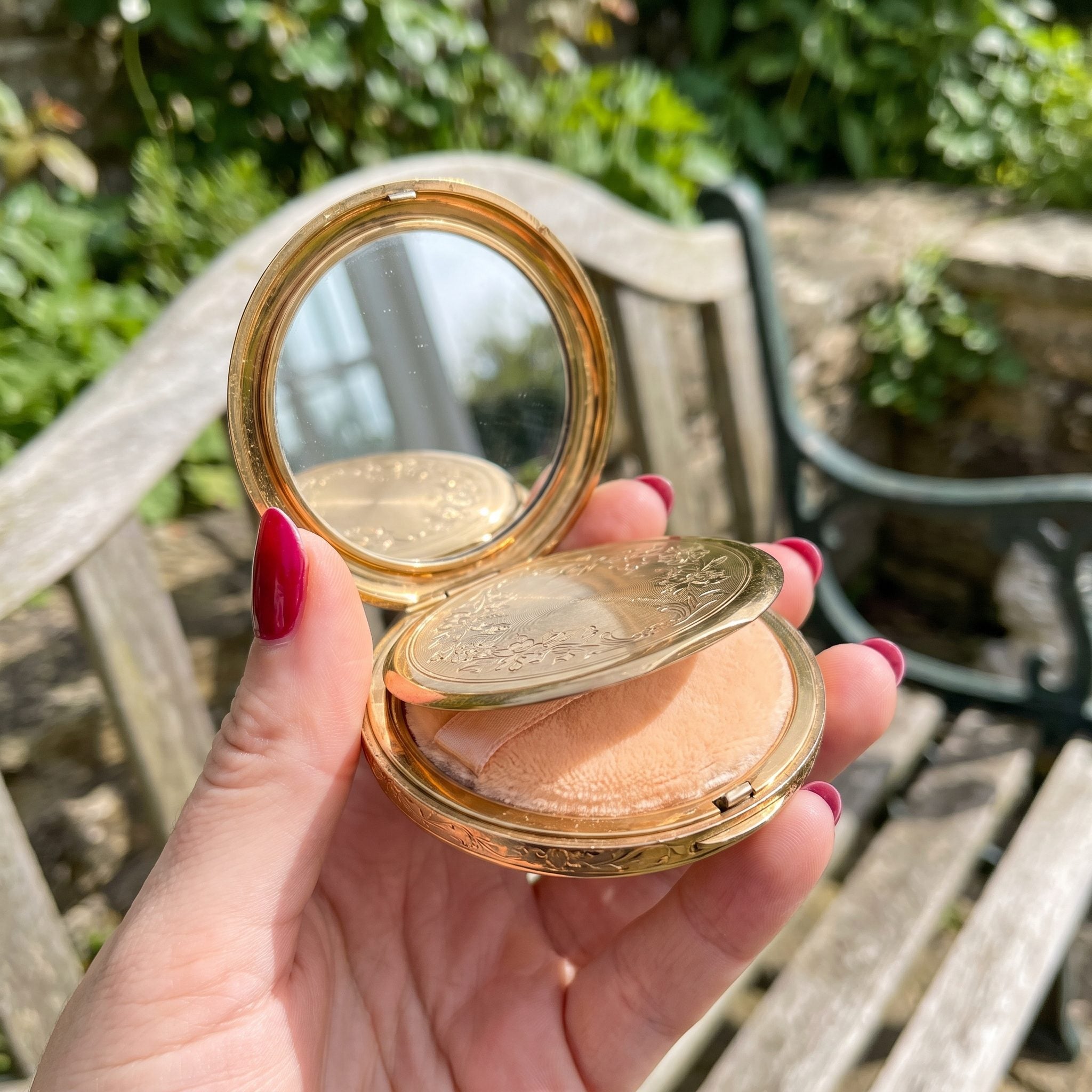 1950s mirrored powder compact in a decorative metal case