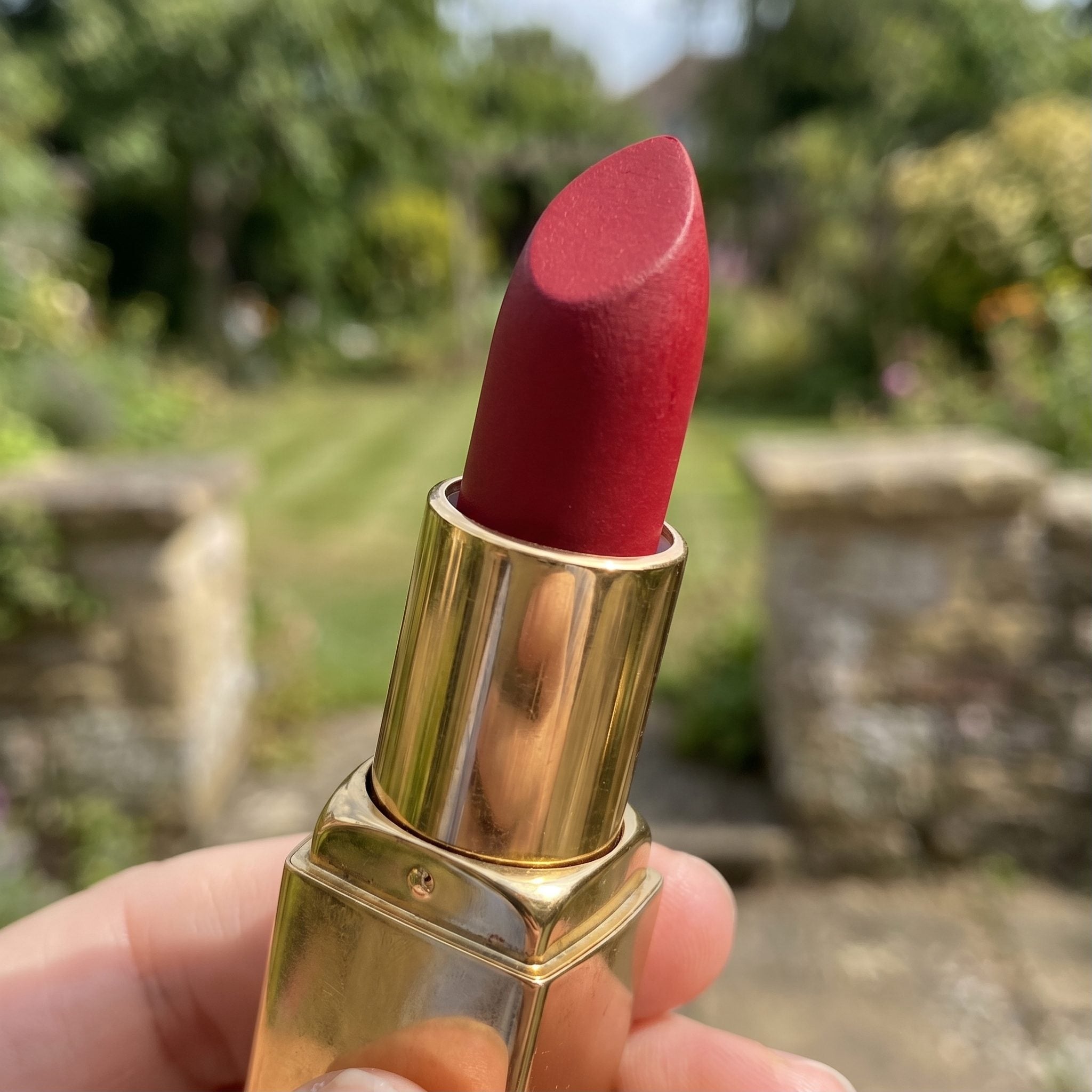 Classic 1950s red lipstick in a gold-colored tube