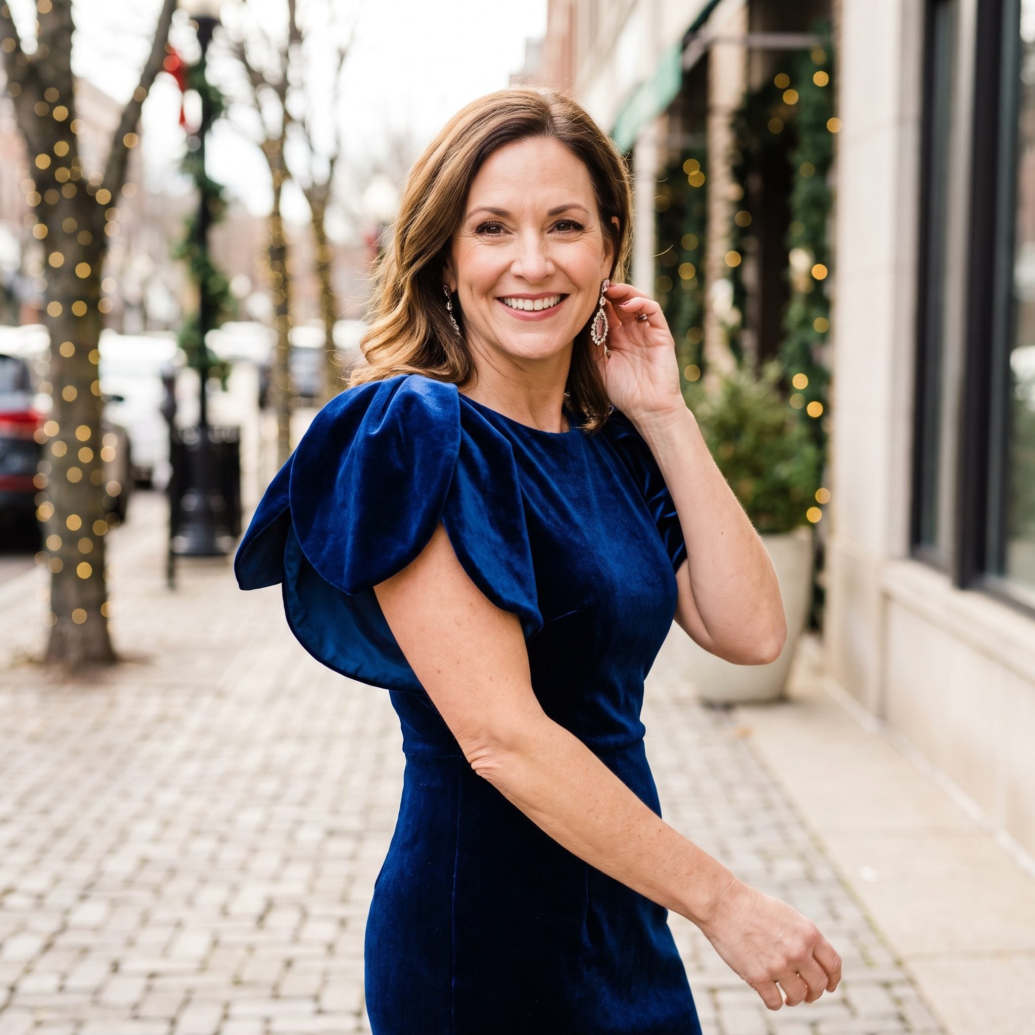 Sapphire velvet cocktail dress with sculpted petal-shaped sleeves and a fitted skirt