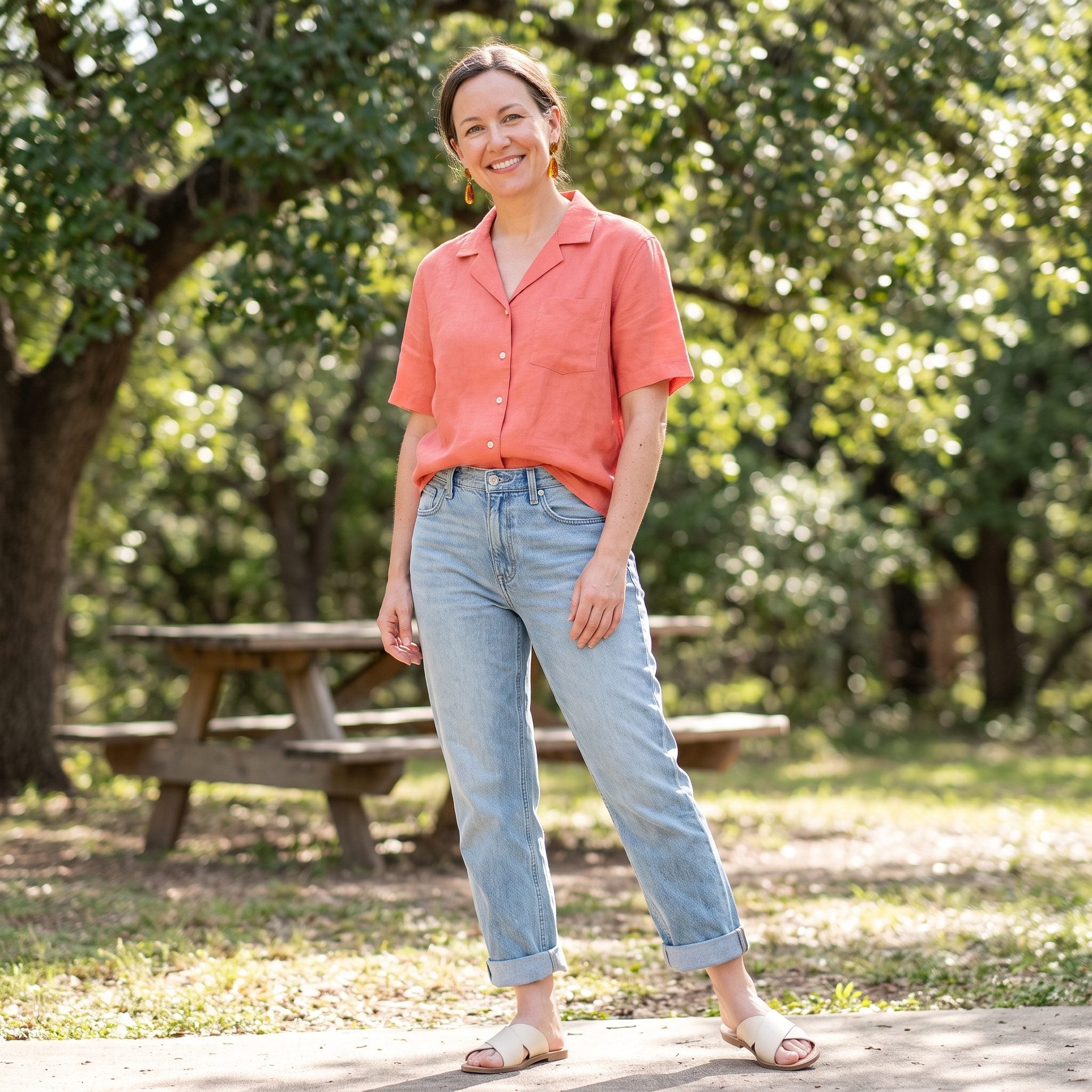 Summer outfit with double-cuffed boyfriend jeans and a coral linen camp shirt